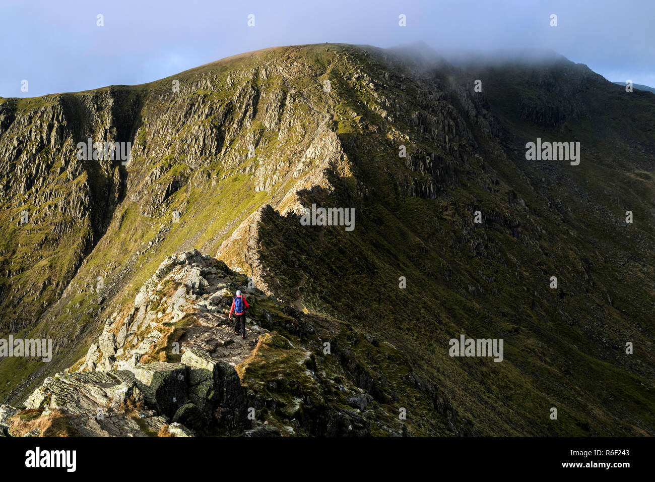 A Walker Making Their Way Along Striding Edge with a Cloud Capped ...