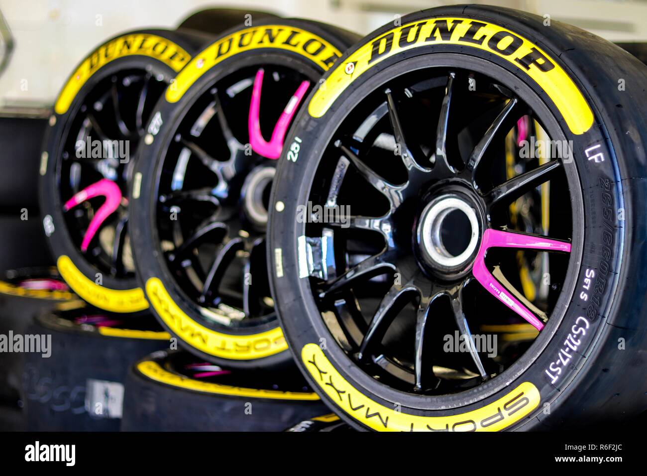 Tyres in a pit garage Stock Photo