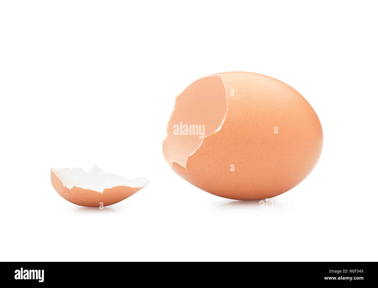 Empty broken egg against white background. Clipping path Stock Photo