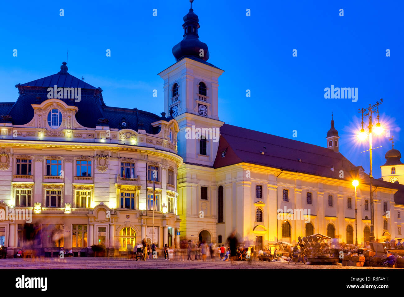 Sibiu city hall and the Holy Trinity Roman Catholic Church, Sibiu, Romania Stock Photo