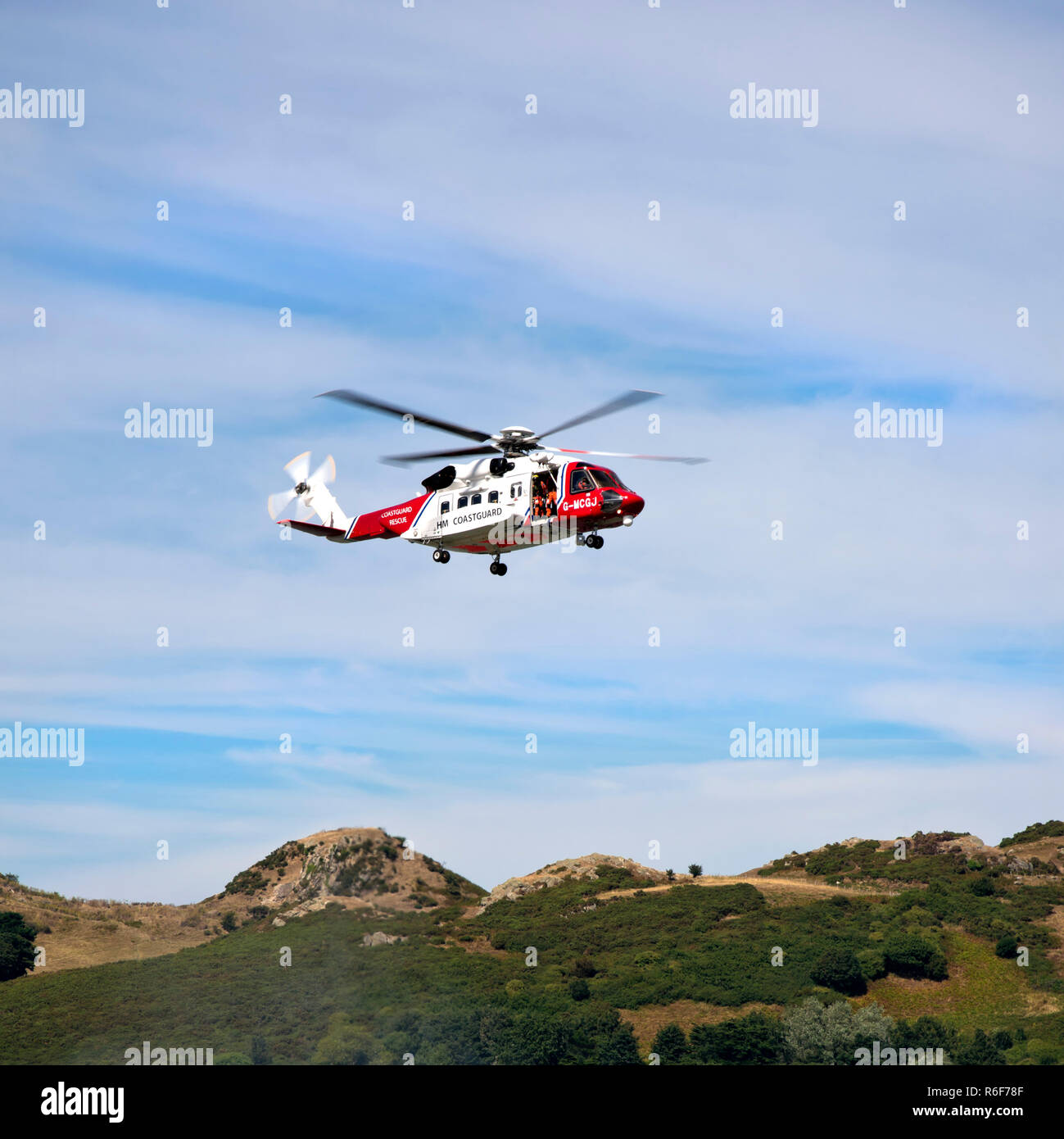 Square close up of a coastguard helicopter in flight. Stock Photo
