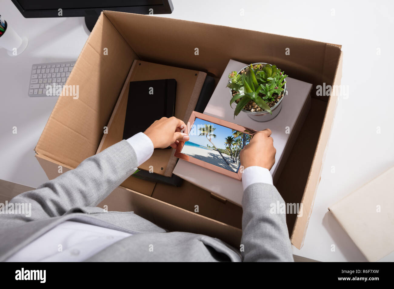 Unhappy woman packing boxes hi-res stock photography and images - Alamy