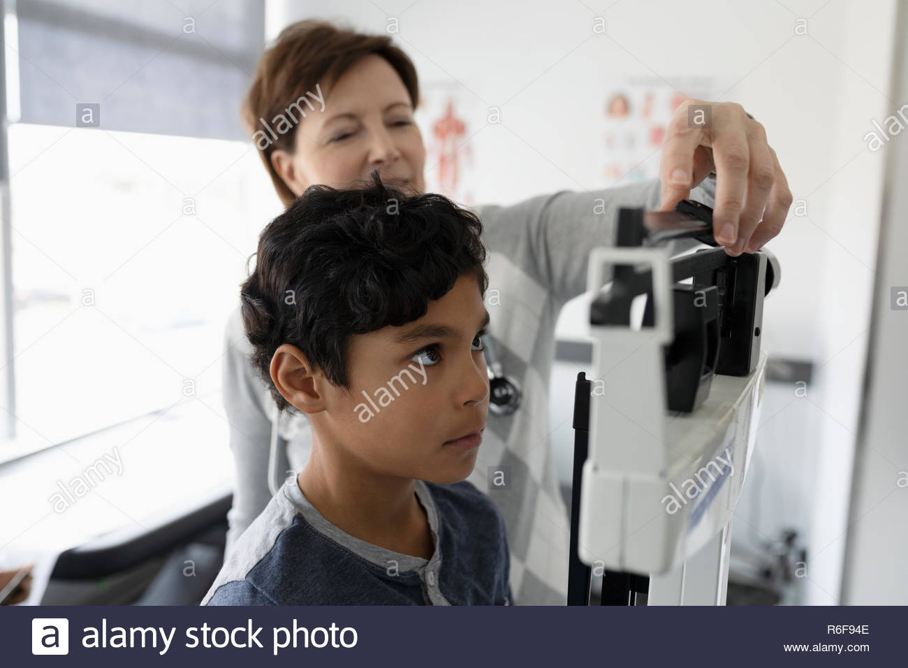 Doctor woman on weighing scale hires stock photography and images Alamy
