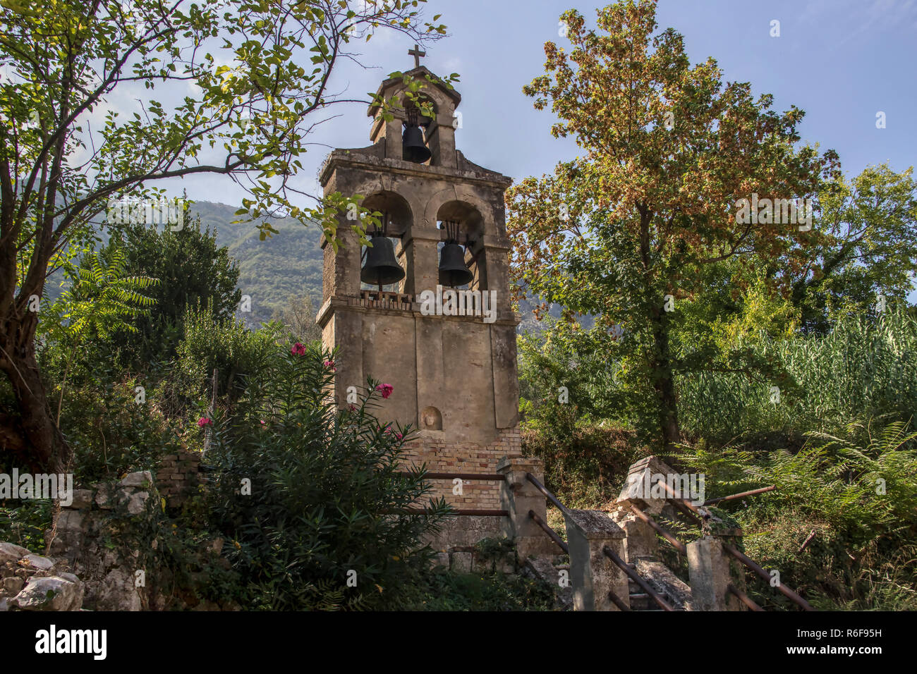 Montenegro - Bell tower in the courtyard of the Church of the Nativity of the Blessed Virgin Mary (Our Lady's Temple) in a coastal town of Prcanj Stock Photo