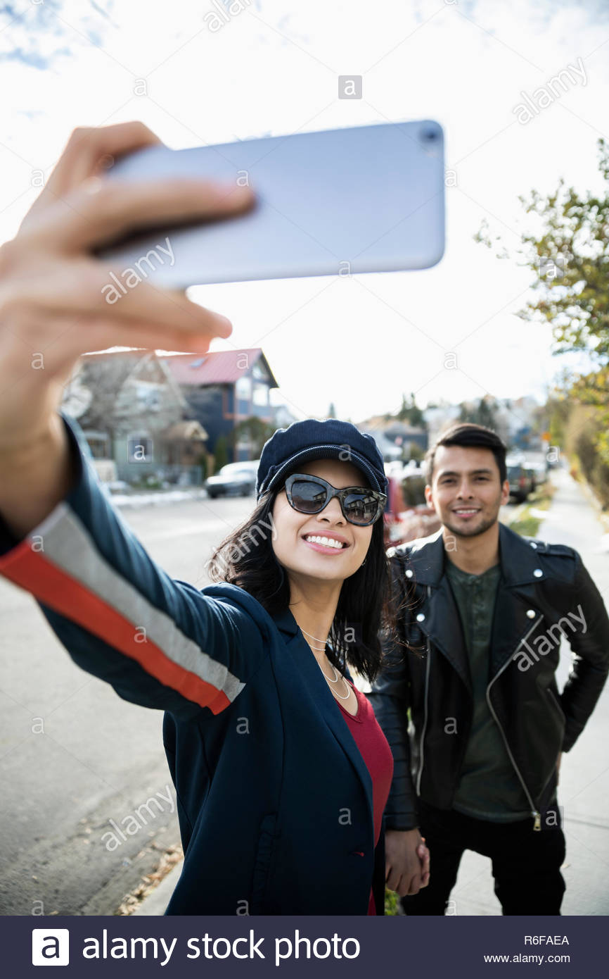 Smart couple holding hands hi-res stock photography and images - Alamy