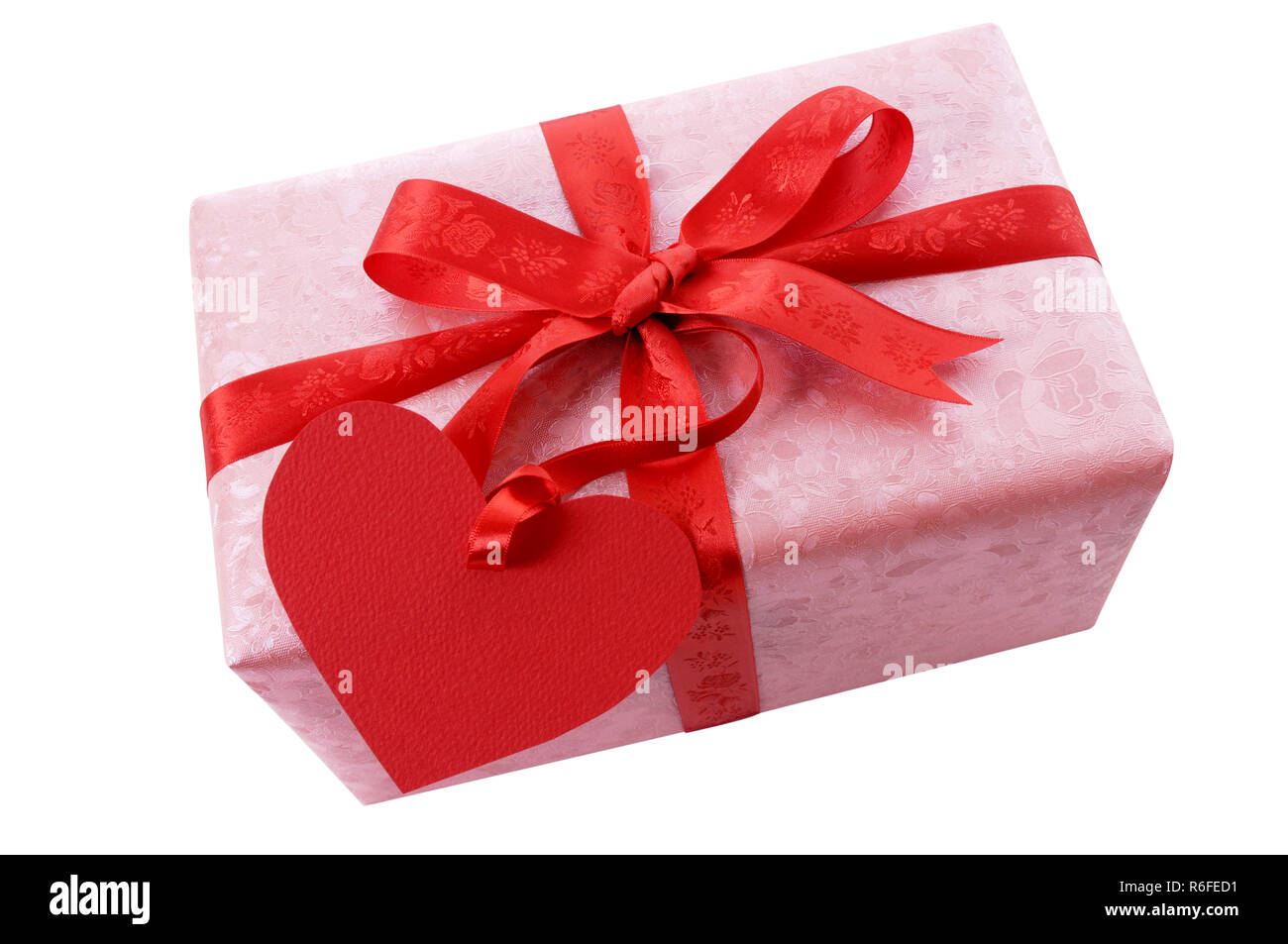 Valentine gift with red ribbon and heart shape gift tag isolated on a ...