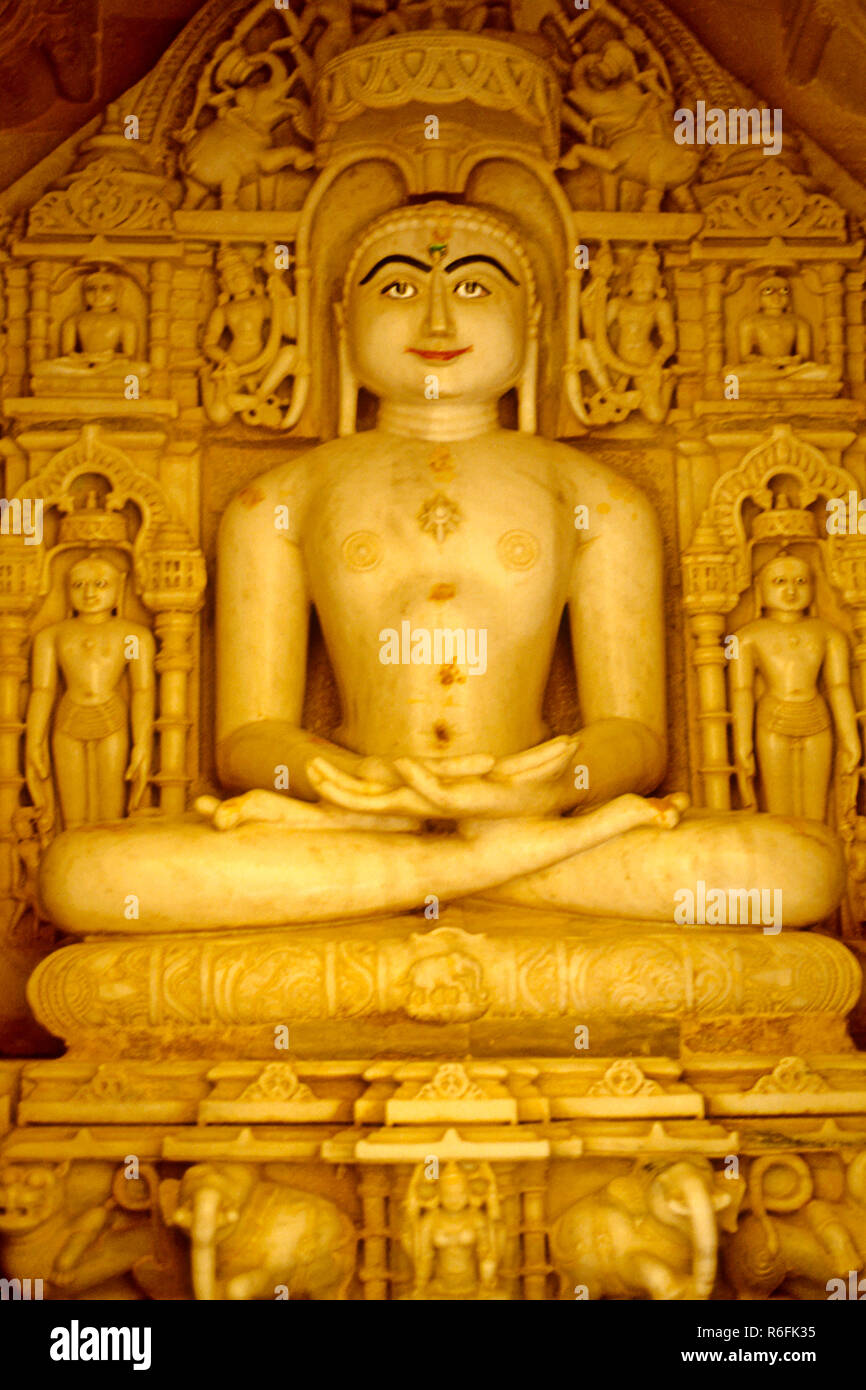 jain temple lord mahavir white marble stone idol jaisalmer rajasthan india Stock Photo