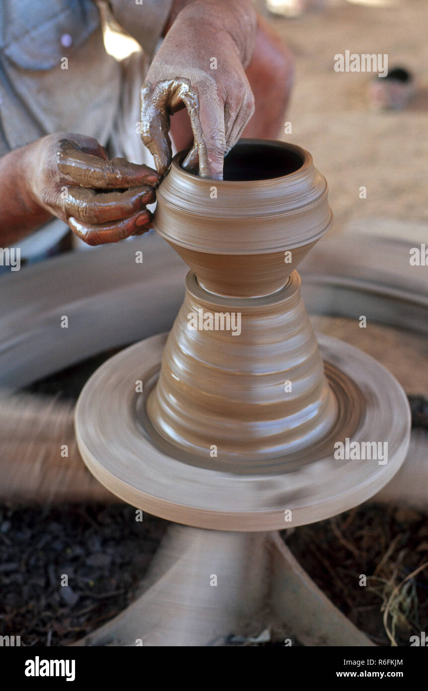 Potter making earthen pot, Close up on a traditional potter at work