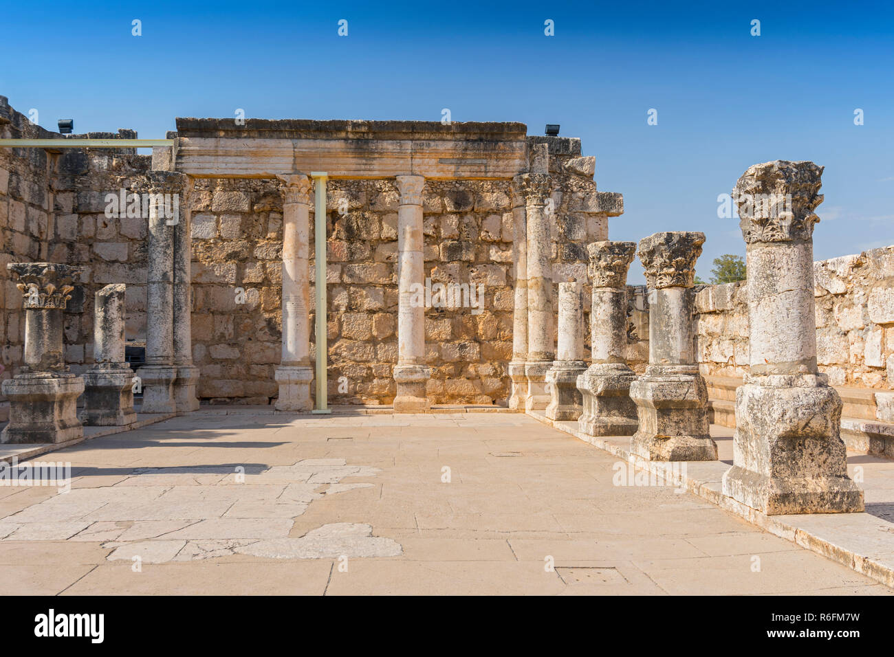Ruins Of The Old Synagogue In Capernaum By The Sea Of Galilee, Israel Stock Photo