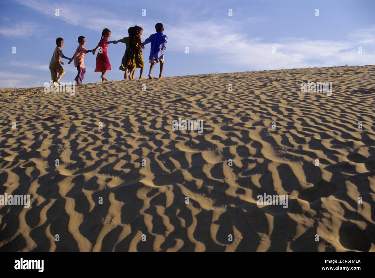Children on Sand Dunes Stock Photo