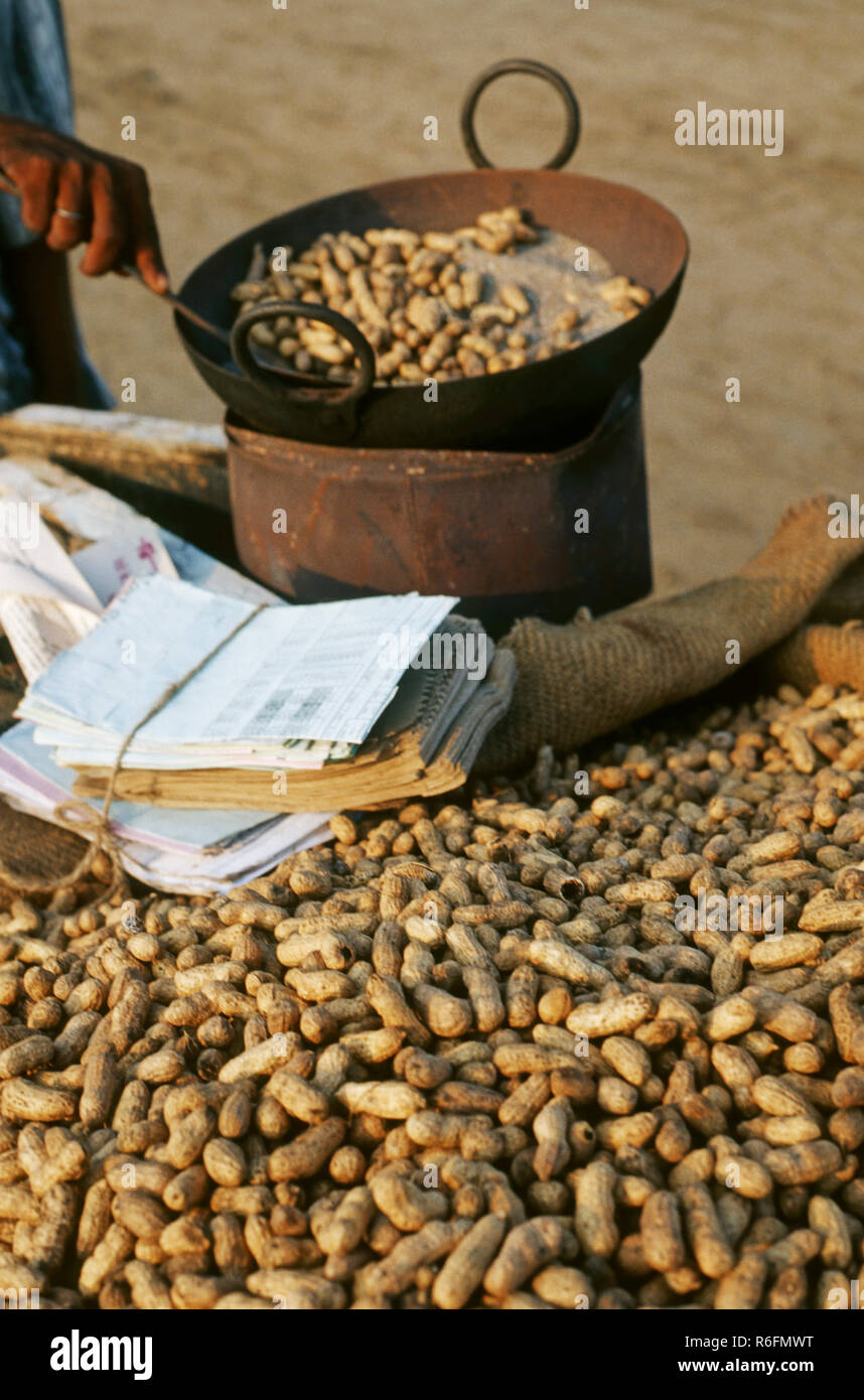 Peanuts sold after roasting on roadside stall, india Stock Photo