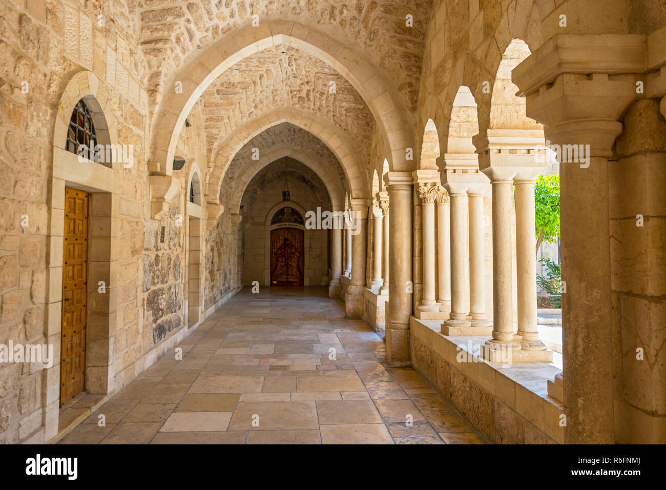 The Inner Courtyard Of The Church Of The Nativity Is Surrounded By Beautiful Covered Terraces With Stone Columns, Bethlehem, Palestine Stock Photo