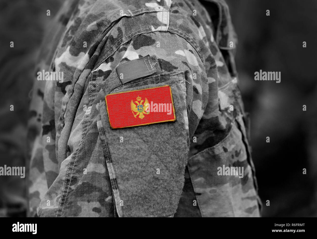 Flag of Montenegro on soldiers arm (collage). Stock Photo
