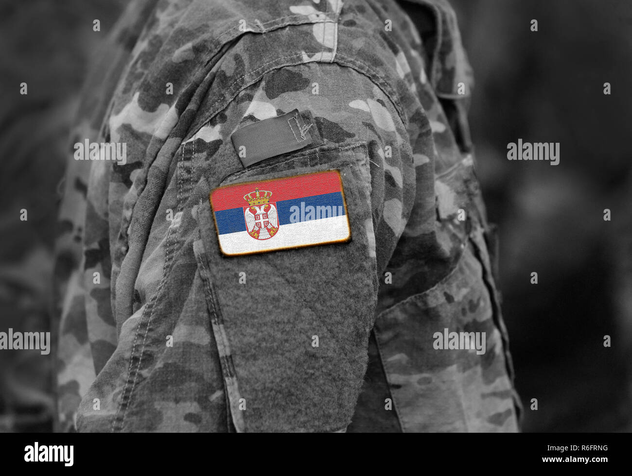 Flag of Serbia on soldiers arm (collage). Stock Photo