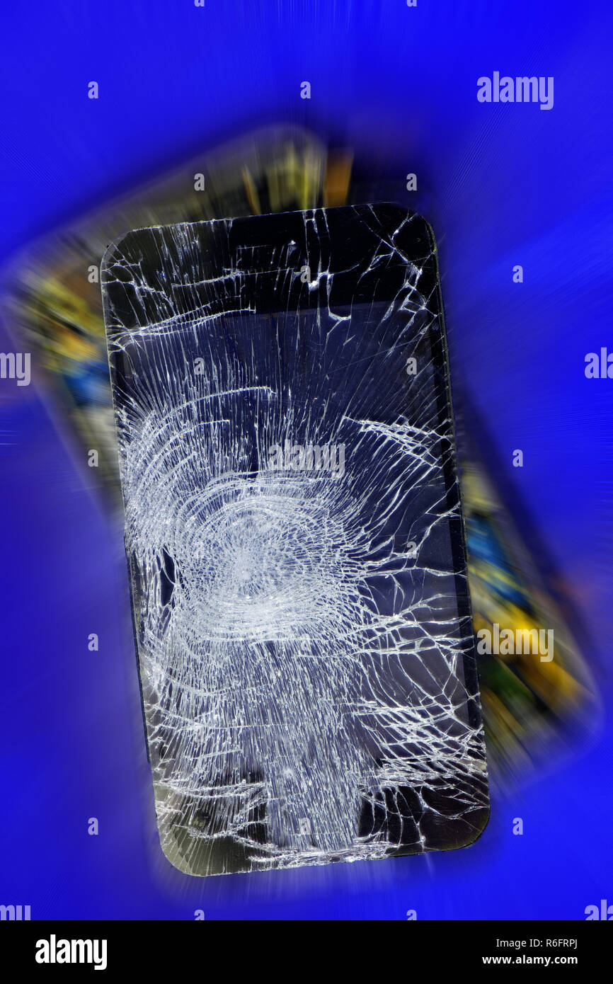 Mobile phone cellphone dropped broken and smashed open Stock Photo