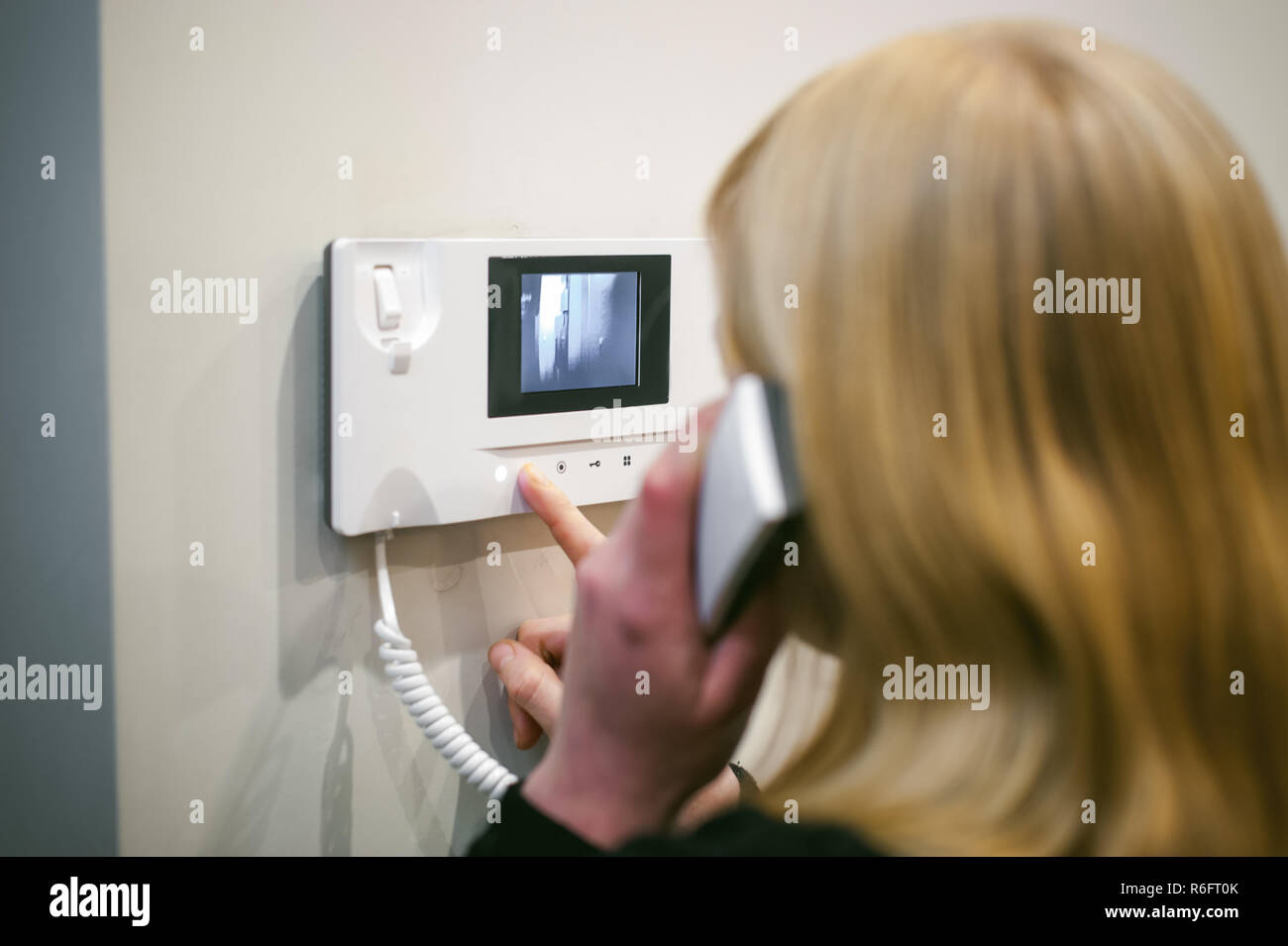 blonde woman answers the call while holding the phone to your