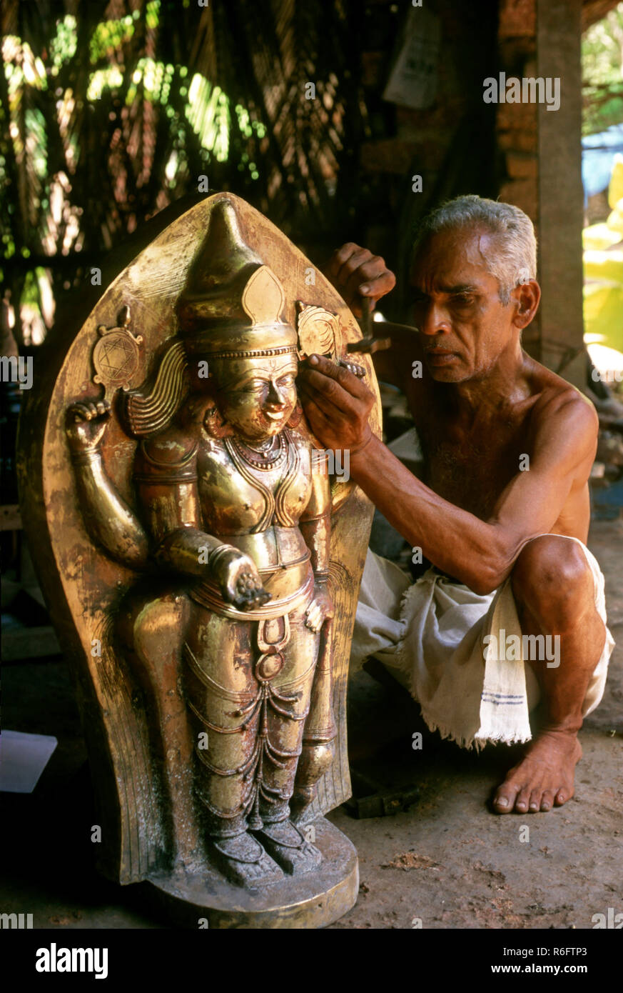 man making bronze statue at kunnimangalam, kerala, india Stock Photo