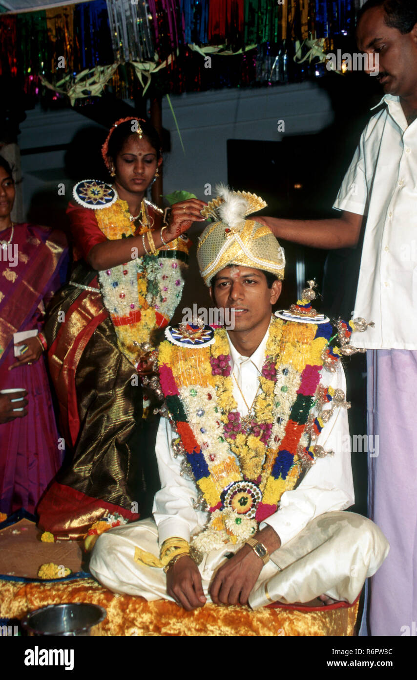 Bride and bridegroom performing vidhi, sequence of Nattukottai Chettiar Nagarathar family, Tamil Nadu, India, Asia, Indian, Asian, MR#777A Stock Photo