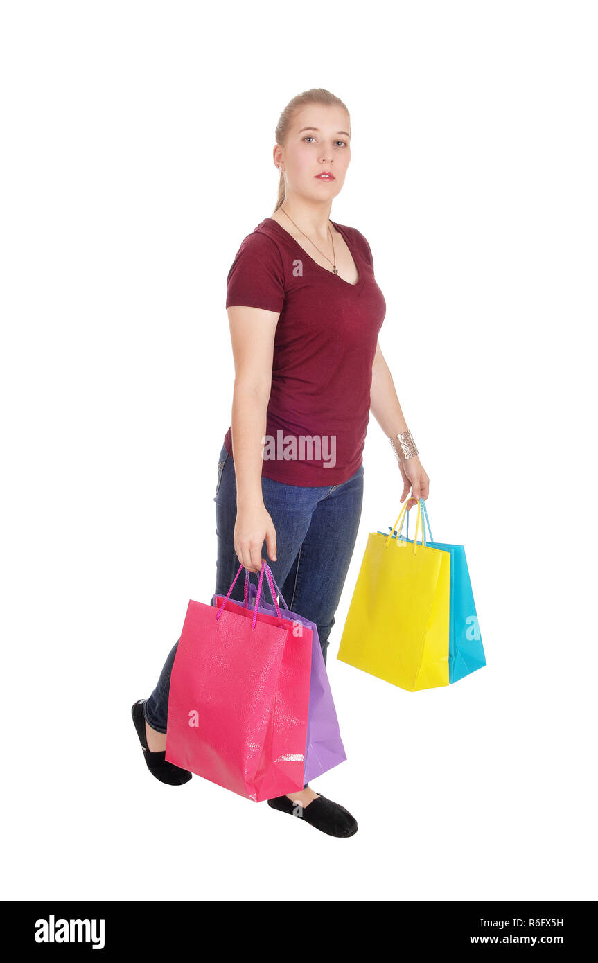 Woman walking with colorful shopping bags Stock Photo Alamy