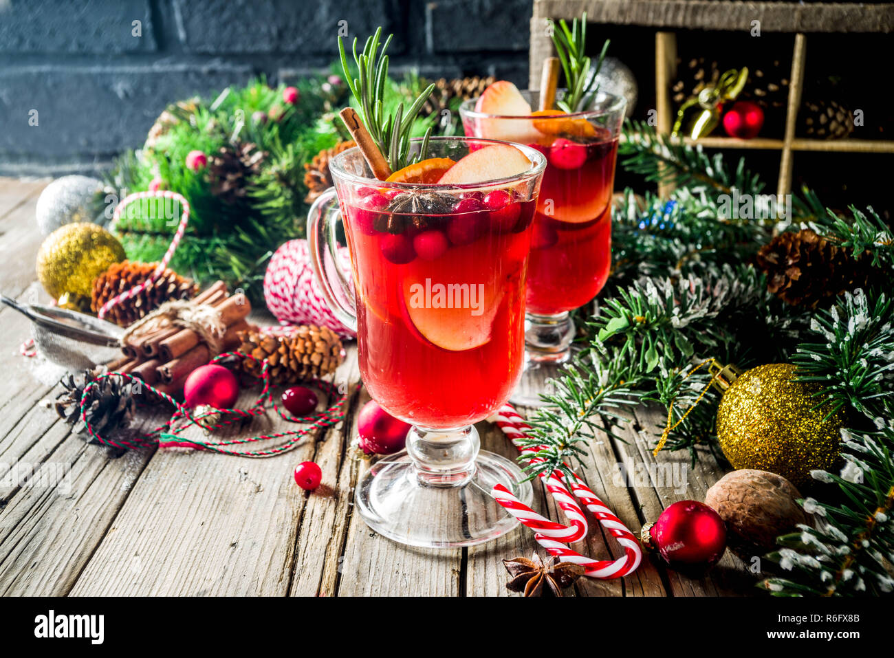 Traditional Christmas Mulled wine, grog or hot spicy sangria cocktail, on  old rustic wooden table with christmas decorations and fir tree branches  cop Stock Photo - Alamy