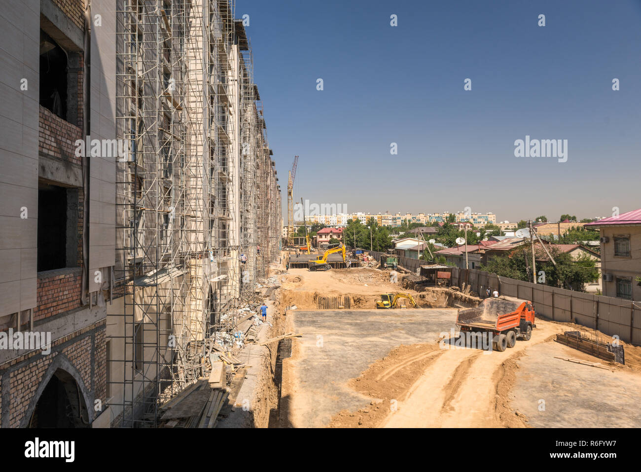 on the construction site, excavator and dump truck Stock Photo