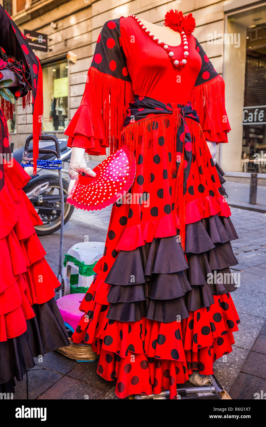 beautiful traditional red flamenco dress hanged for display in a shop spain  Stock Photo - Alamy
