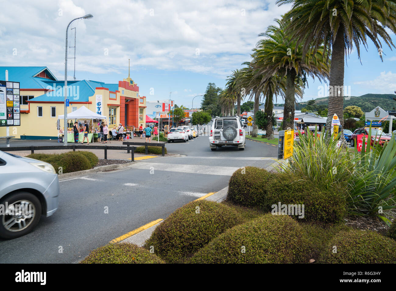 RAGLAN, NEW ZEALAND - JANUARY 14, 2018; View along Bow Street in small town on busy summer Sunday morning vehilces, local market and people moving abo Stock Photo