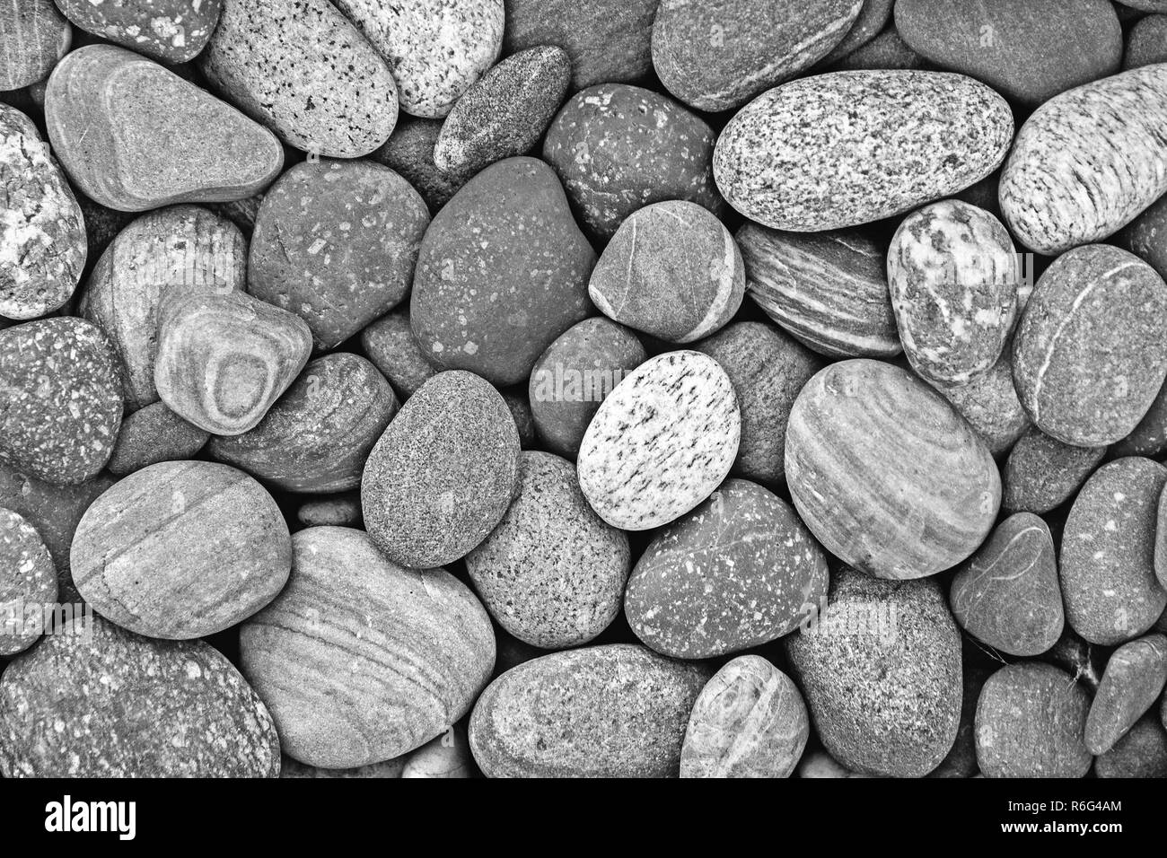 Black and white pebble stones background Stock Photo - Alamy