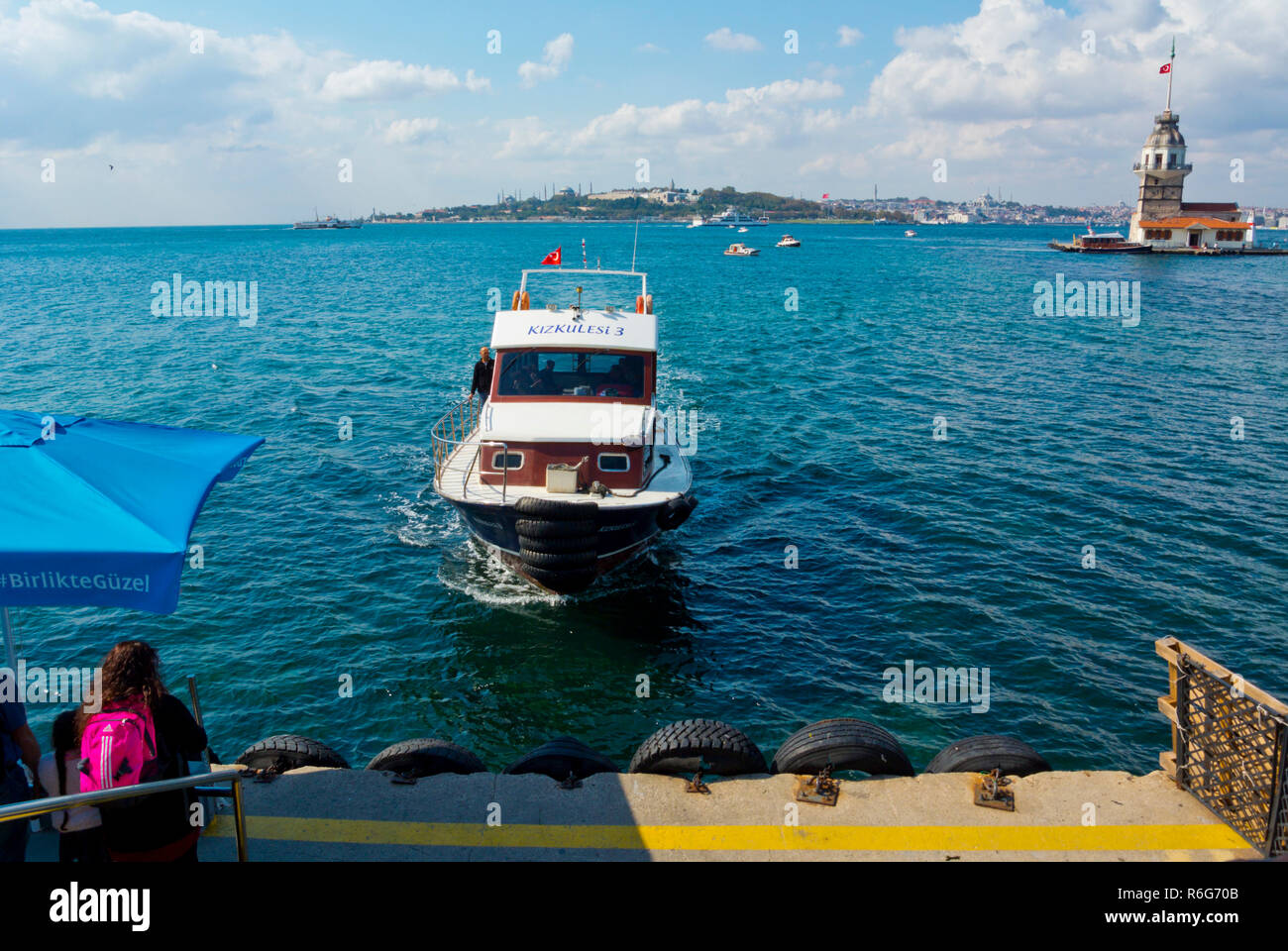 Boat transport between Kiz Kulesi, Maiden's Tower, and seaside promenade, Uskudar, Istanbul, Turkey, Asian side Stock Photo