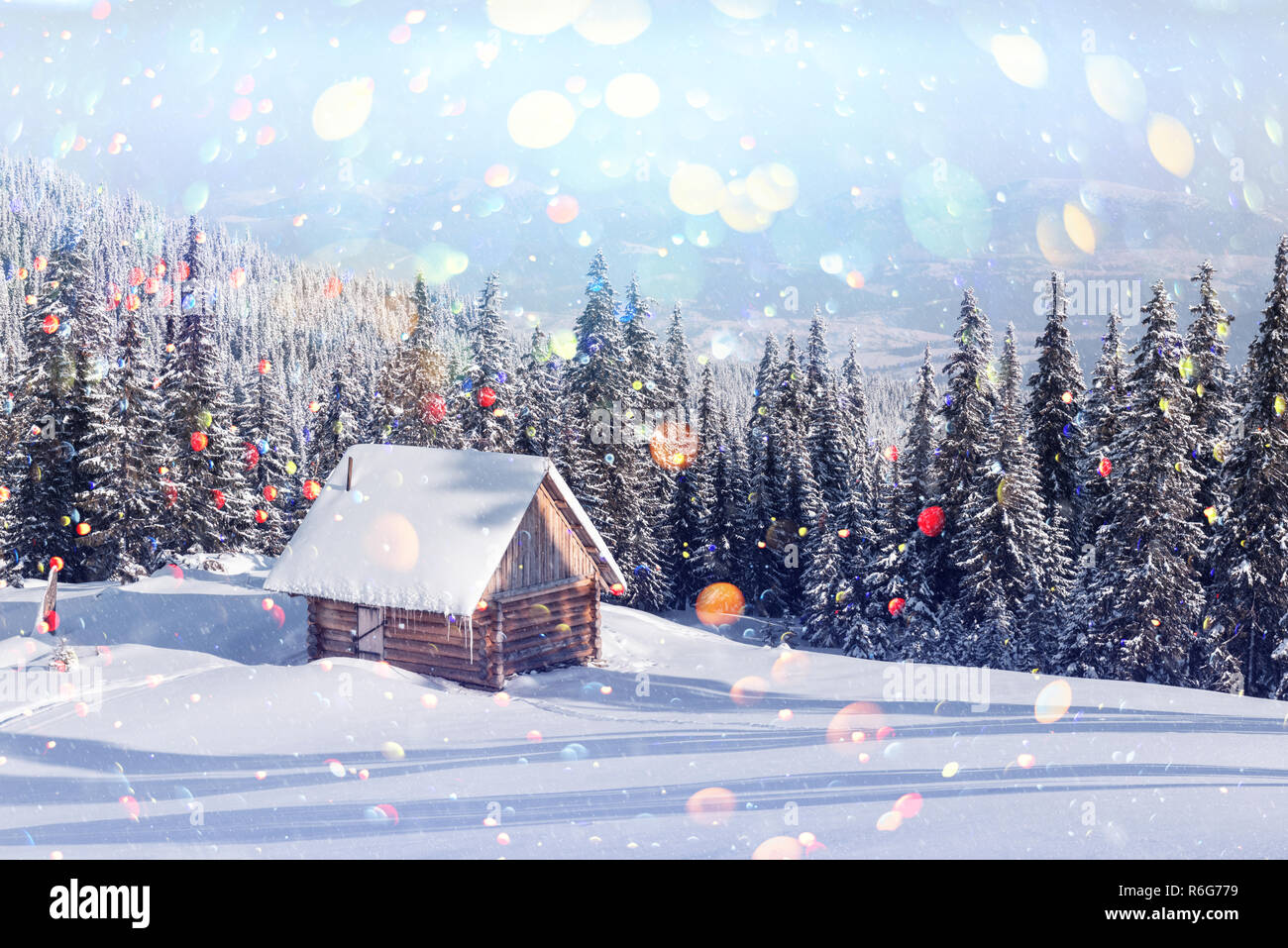 Fantastic winter landscape with wooden house in snowy mountains ...