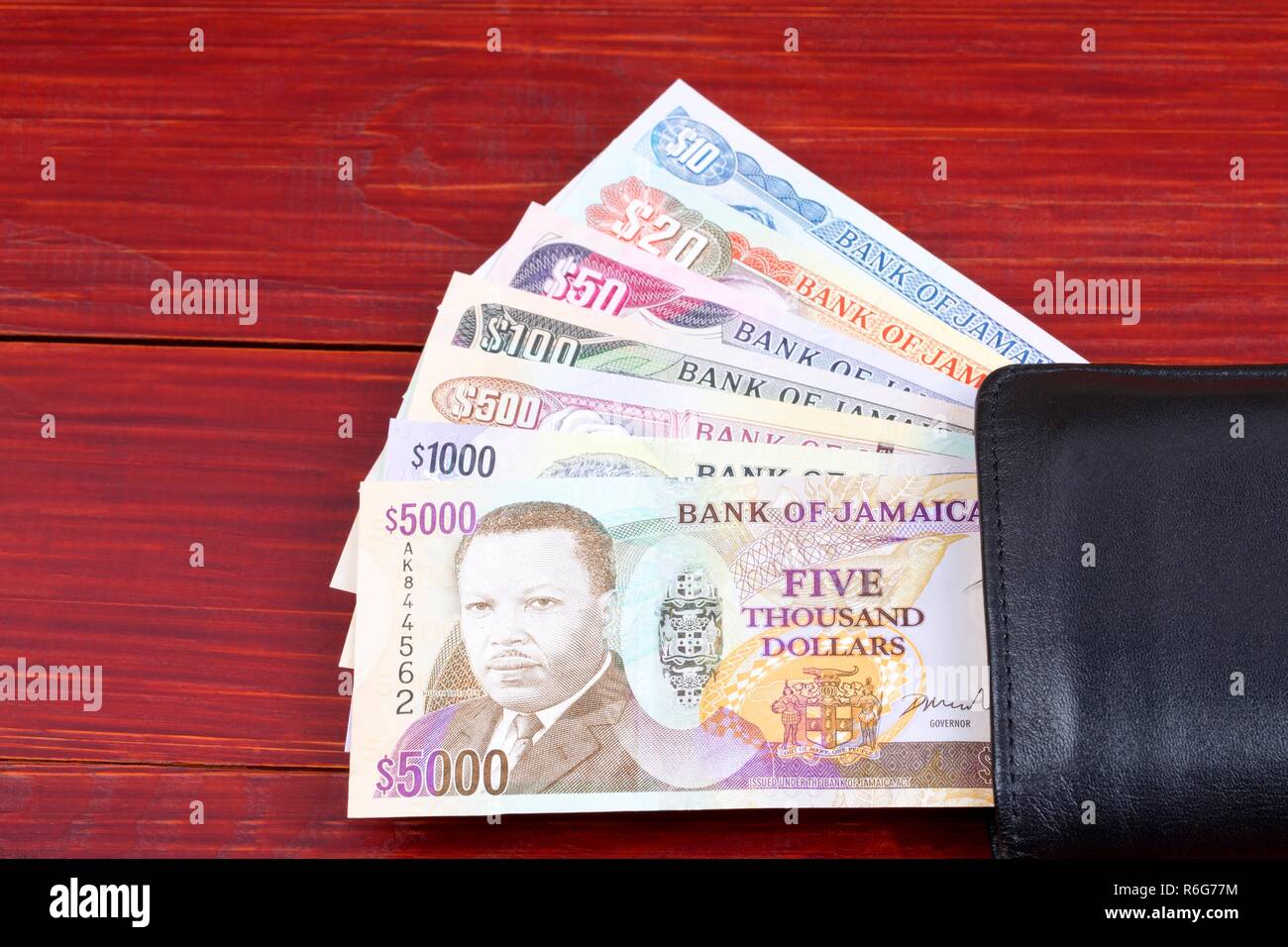 Jamaican money in the black wallet Stock Photo