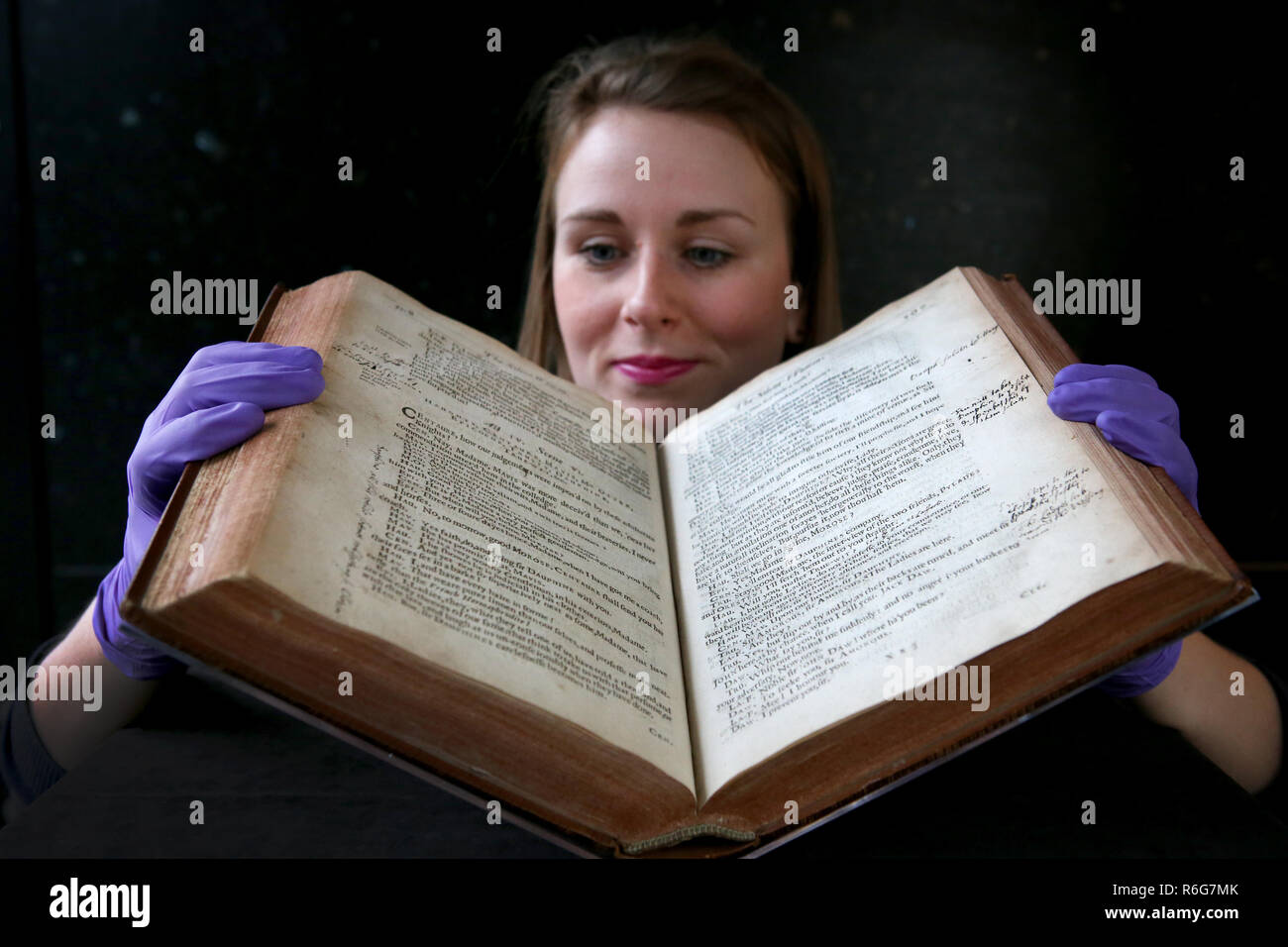 Exhibitions officer Kirsty MacNab, from the University of Edinburgh, takes a closer look at a unique volume of 17th Century plays by dramatist Ben Jonson which is on display in a new exhibition 'Rare Books : Expect the Unexpected' at the university's main library in Edinburgh. Stock Photo