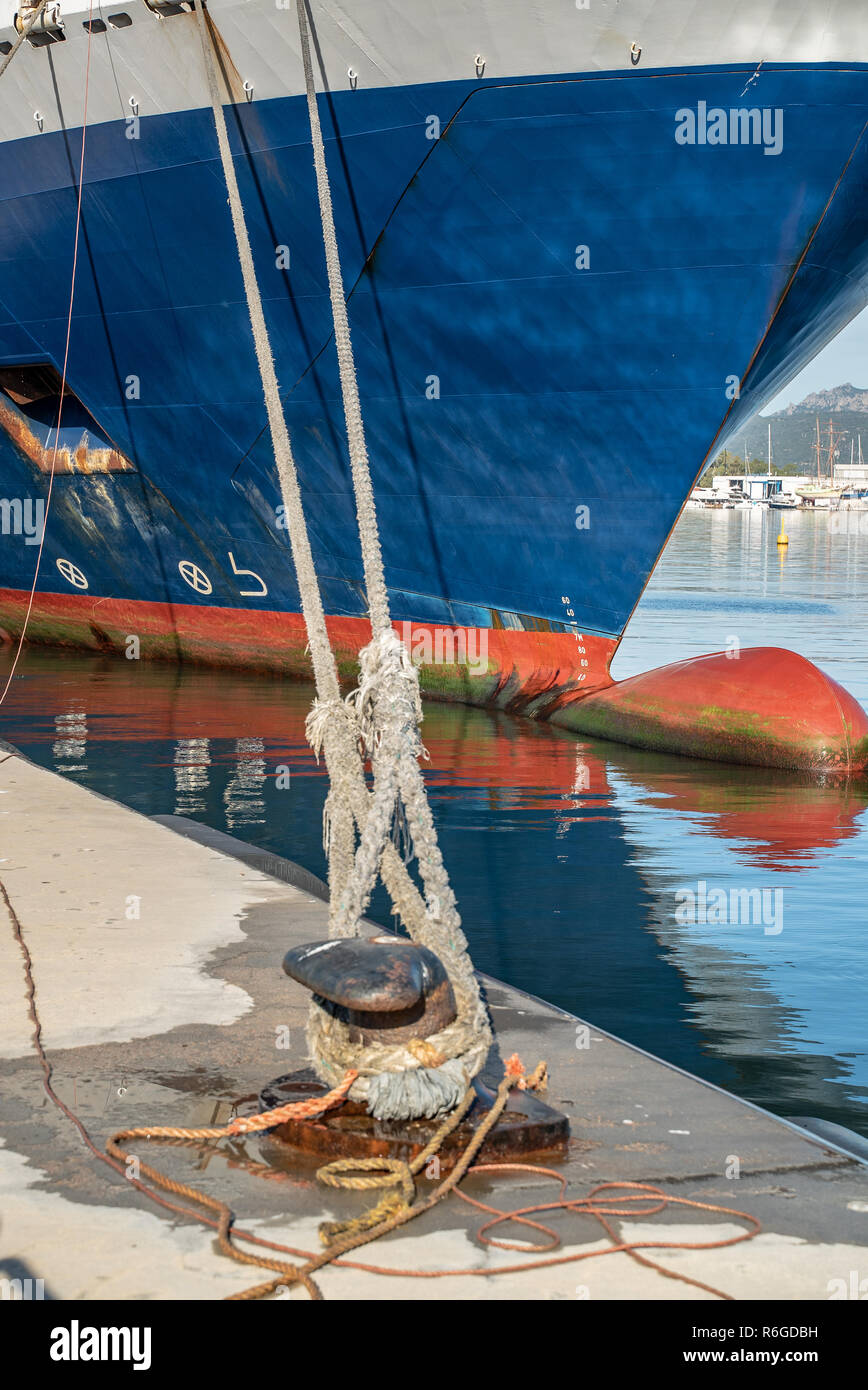 Ferry rope tied to metal boat slip at dock Stock Photo