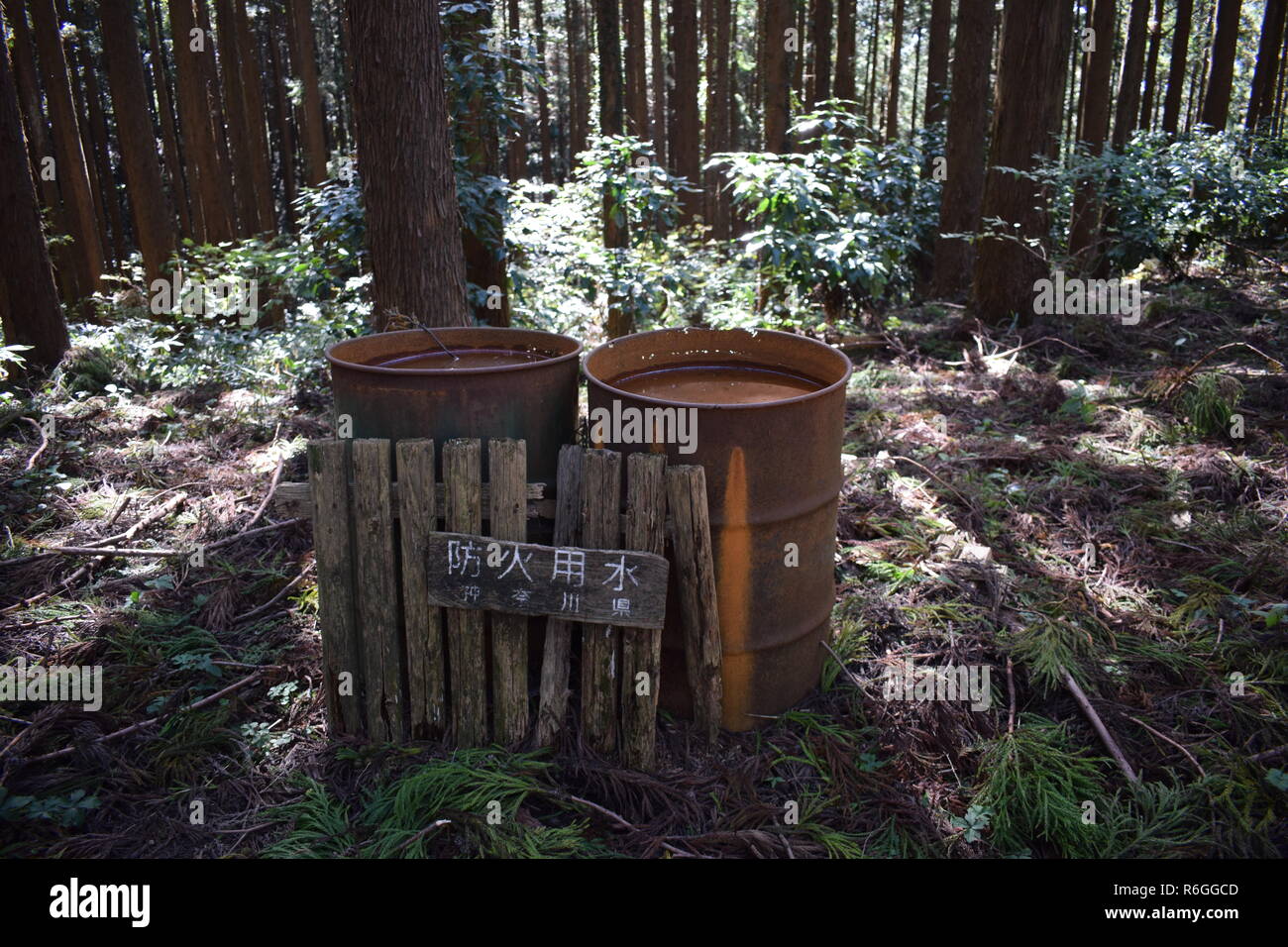Rusting drum holding fire water , Takao, Japan Stock Photo