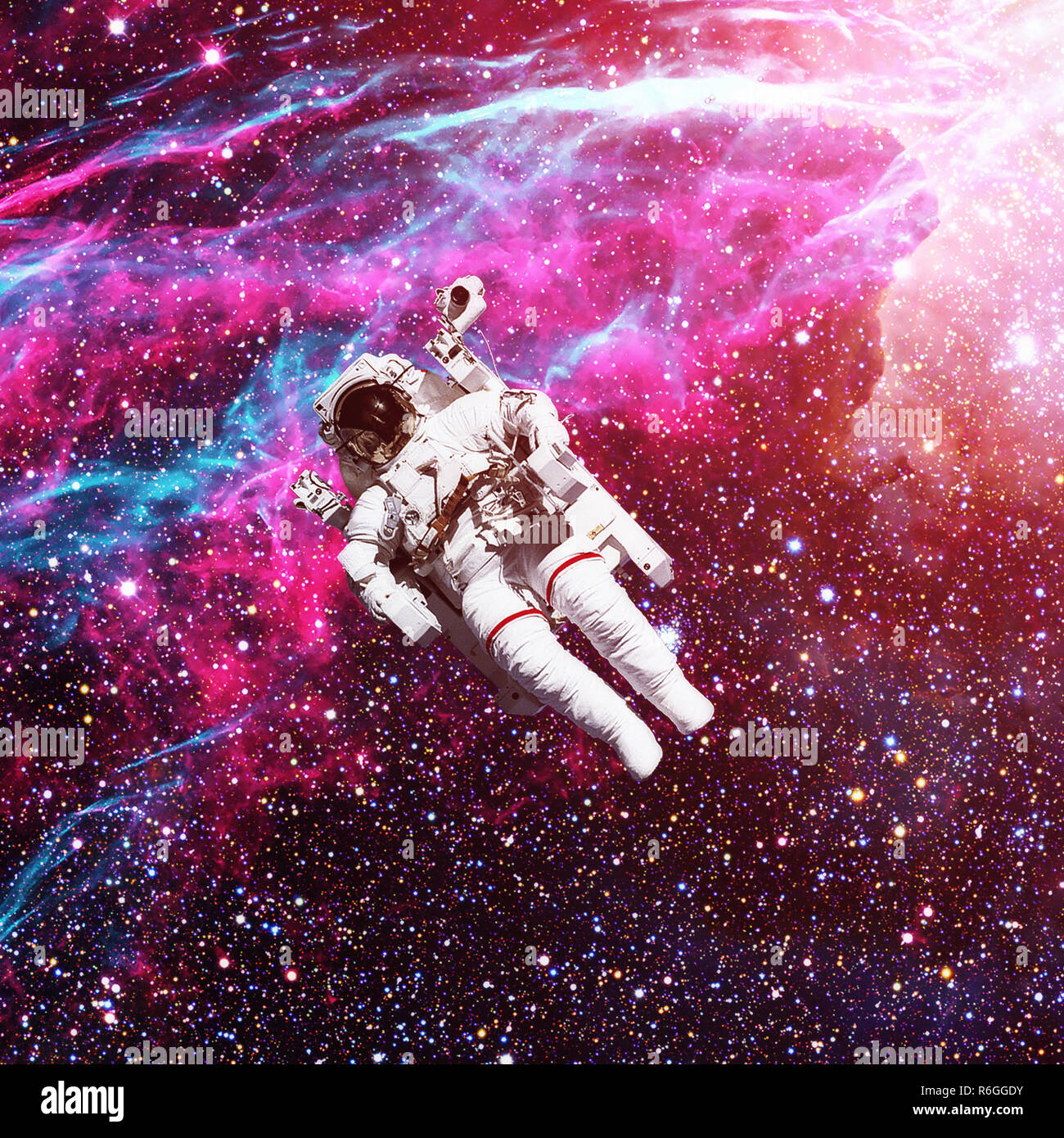 Astronaut in outer space. Nebula on the background. Stock Photo