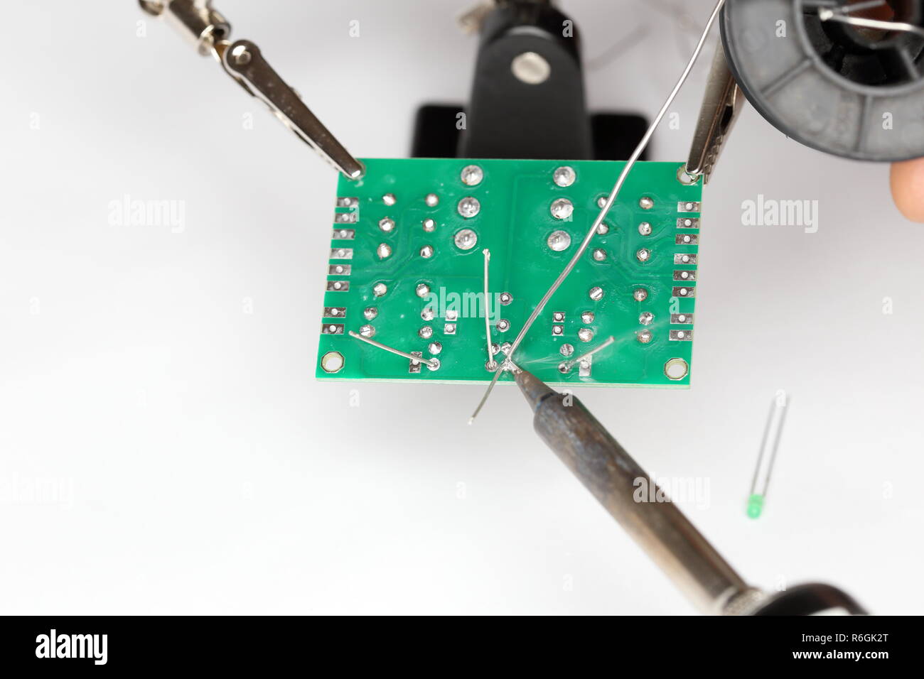 solder electronic components to the board Stock Photo Alamy