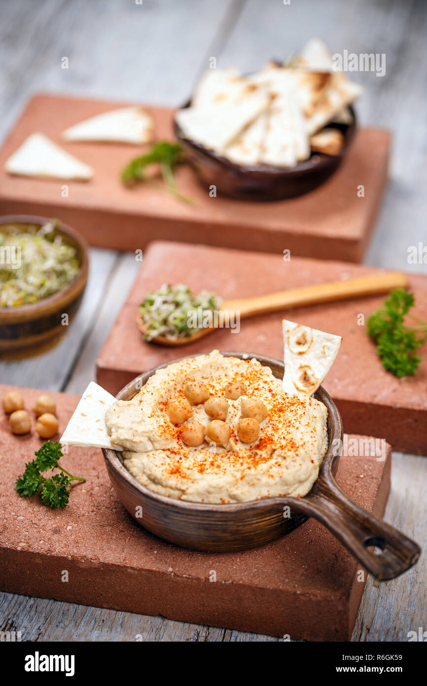 Hummus with pita chips Stock Photo Alamy