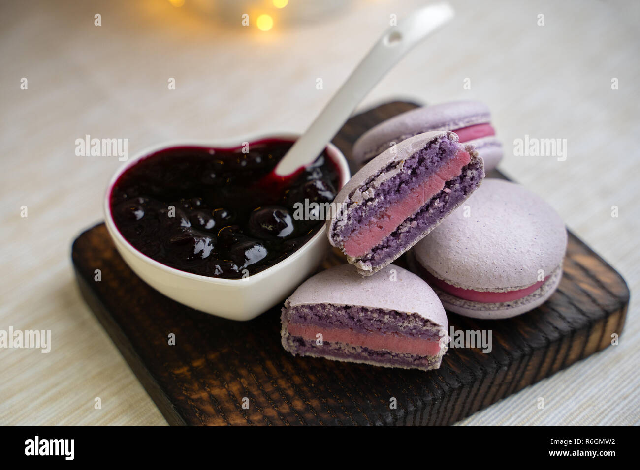 macaroons with currants on a white plate with jam Stock Photo
