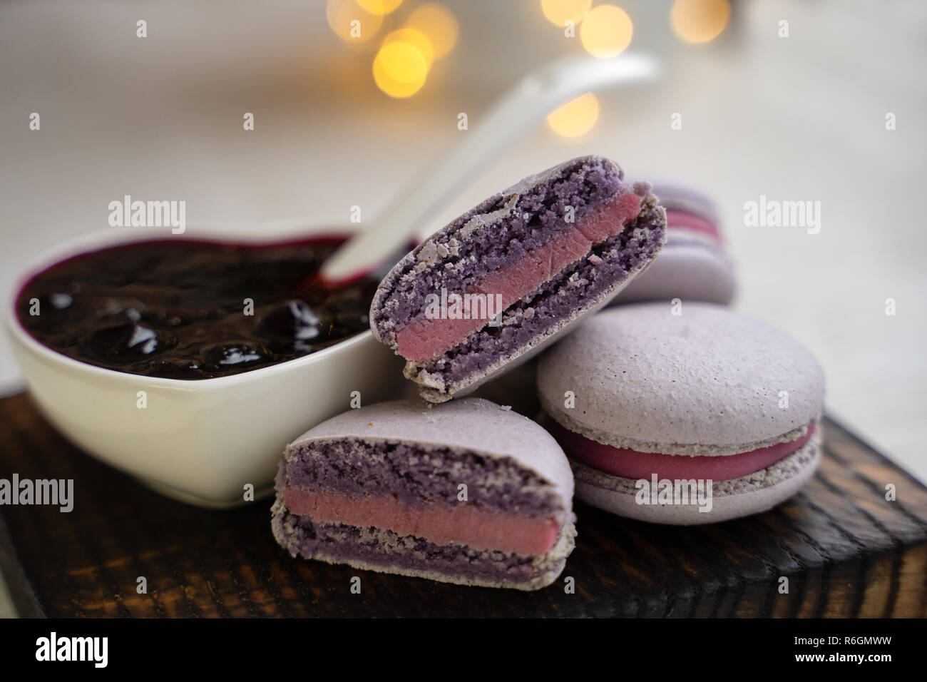 macaroons with currants on a white plate with jam Stock Photo