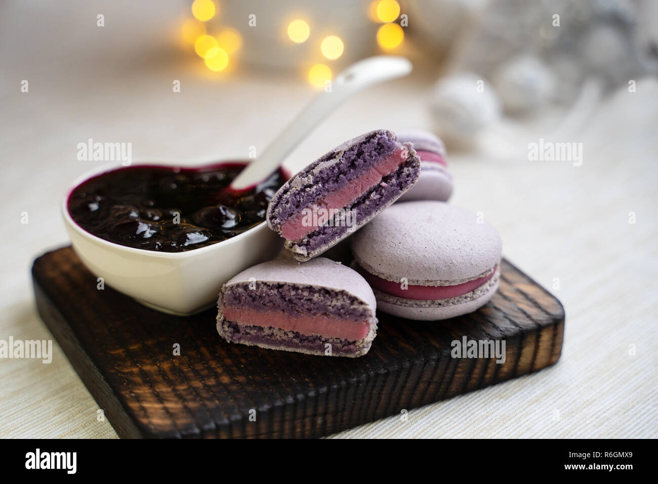 macaroons with currants on a white plate with jam Stock Photo