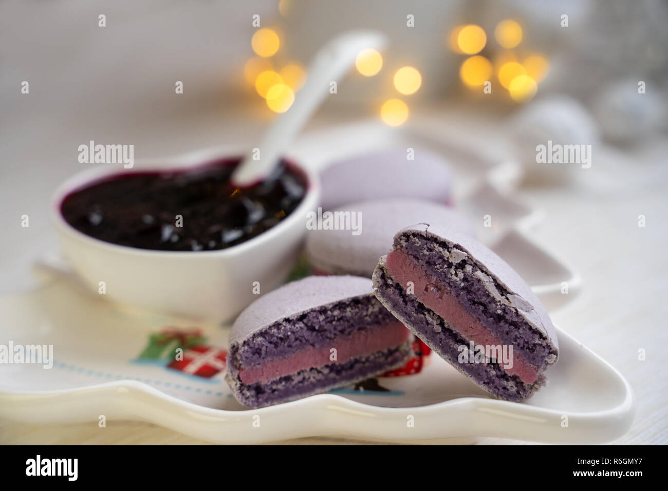 macaroons with currants on a white plate with jam Stock Photo