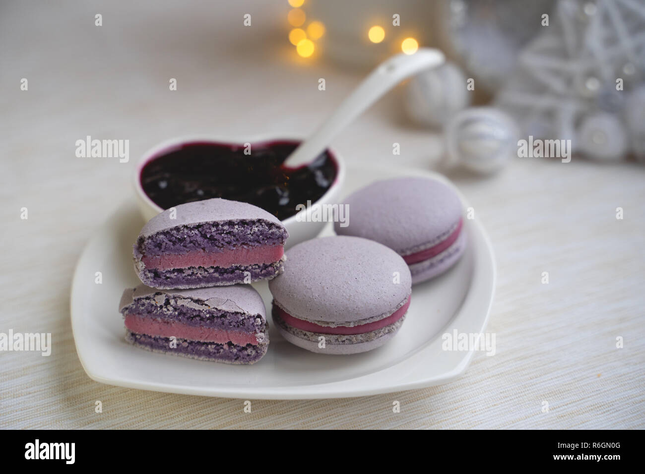 macaroons with currants on a white plate with jam Stock Photo