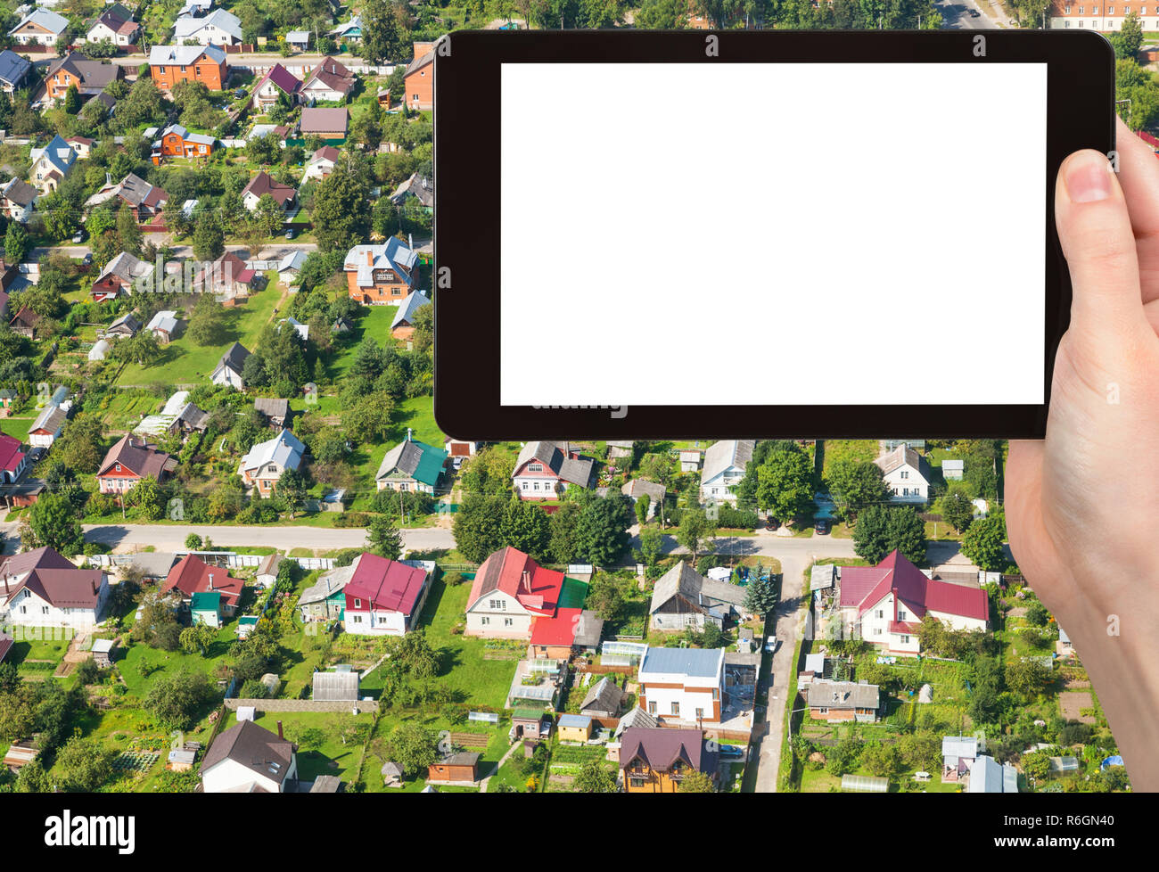 tourist photographs cottages in suburb of