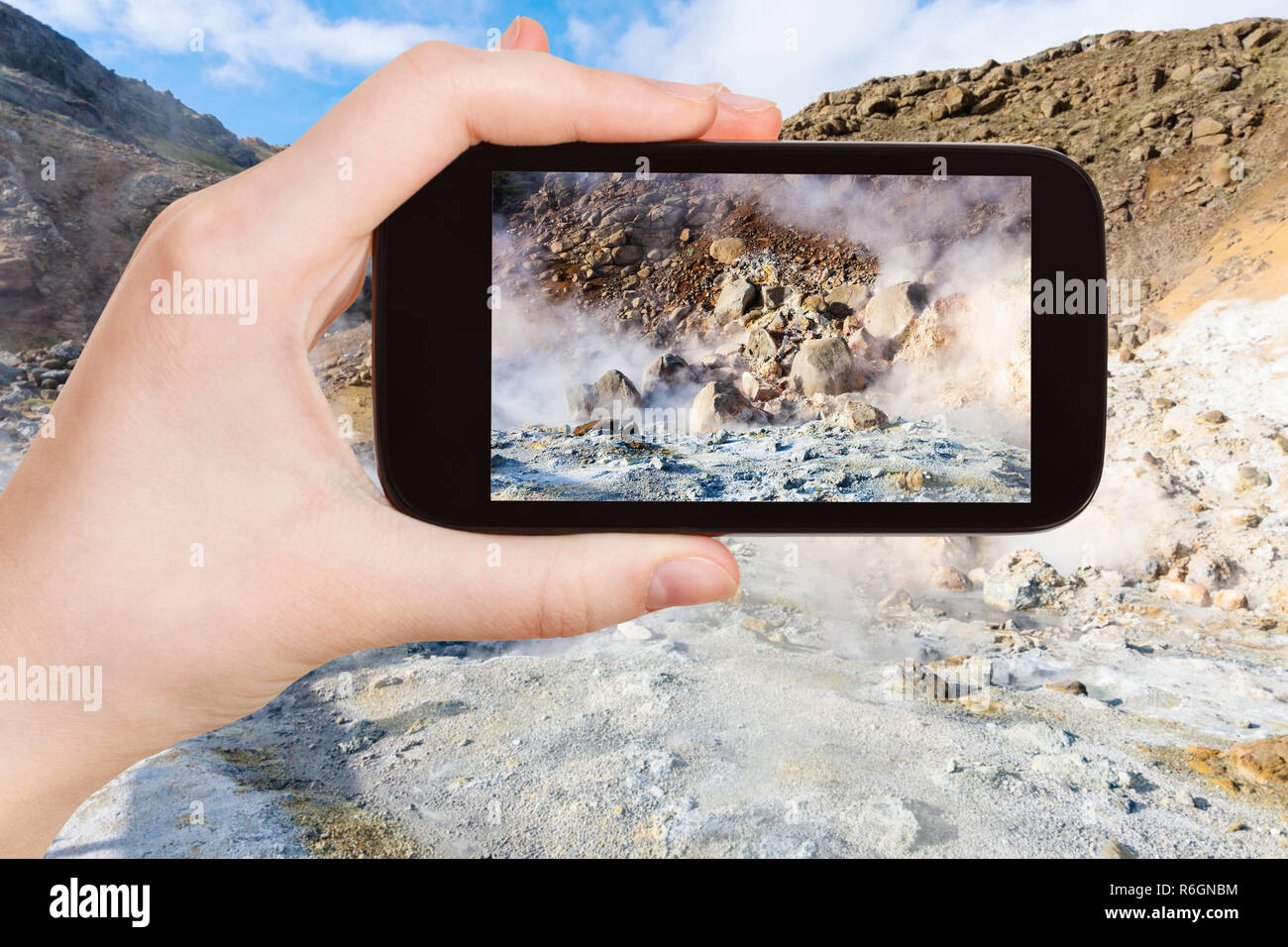 Tourist Photographs Acidic Mudpot In Iceland Stock Photo Alamy