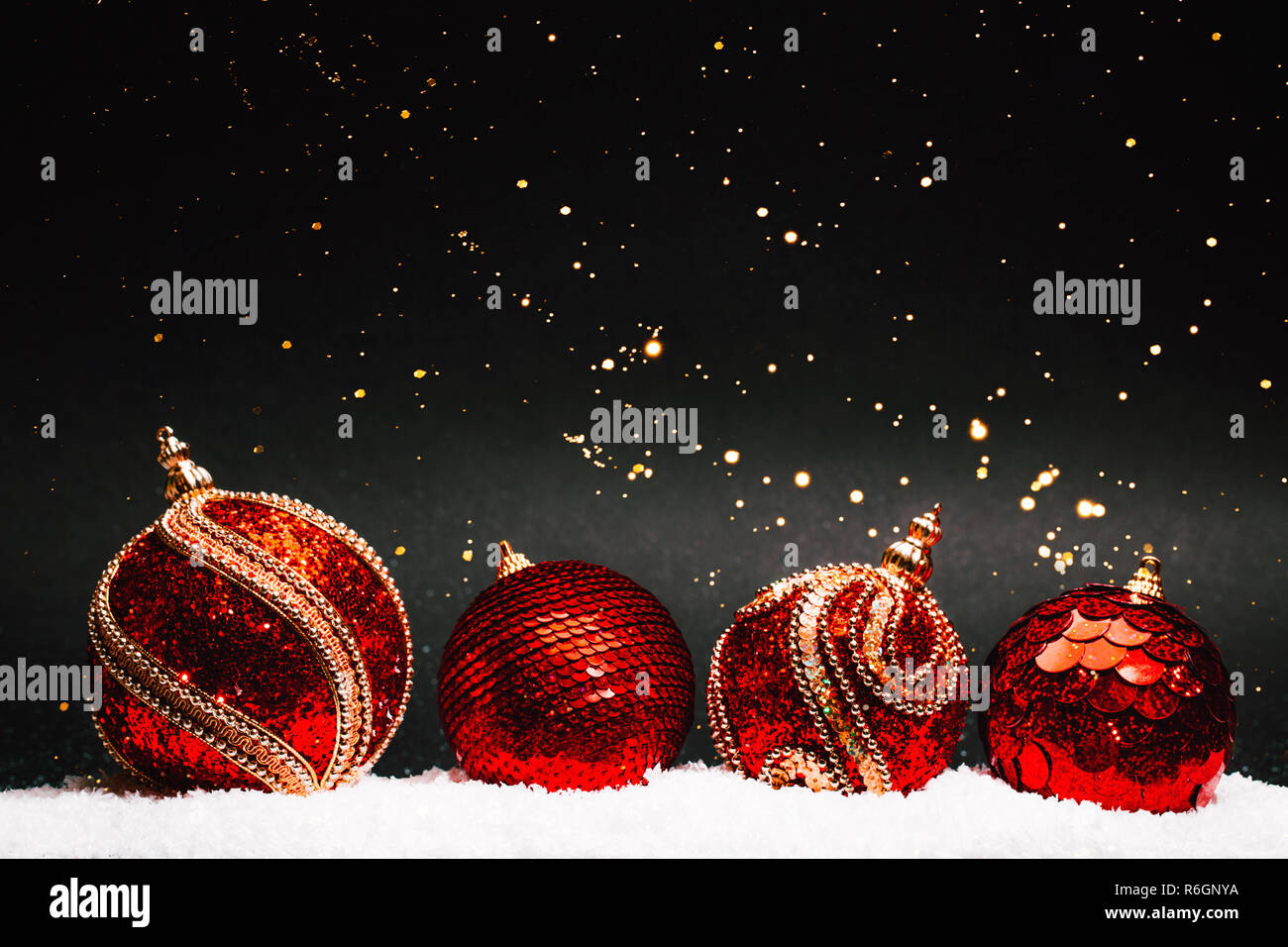 Four Textured Christmas Decorative Balls On Black Background With