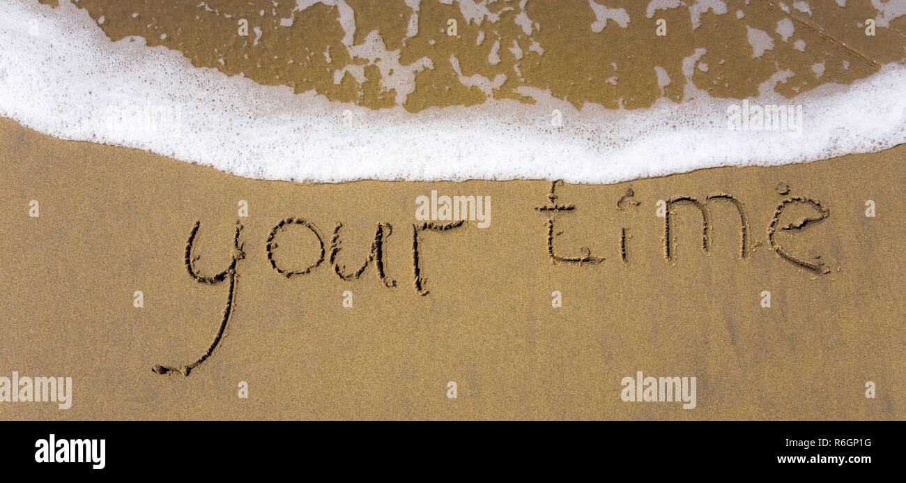 Handwriting word your time written in the sand. Banner Stock Photo - Alamy