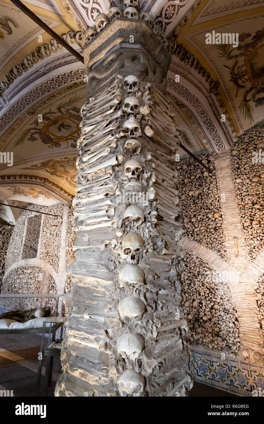 Skulls and bones of former monks decorating the walls inside the Capela dos Ossos bone chapel, Evora, Alentejo, Portugal, Europe Stock Photo