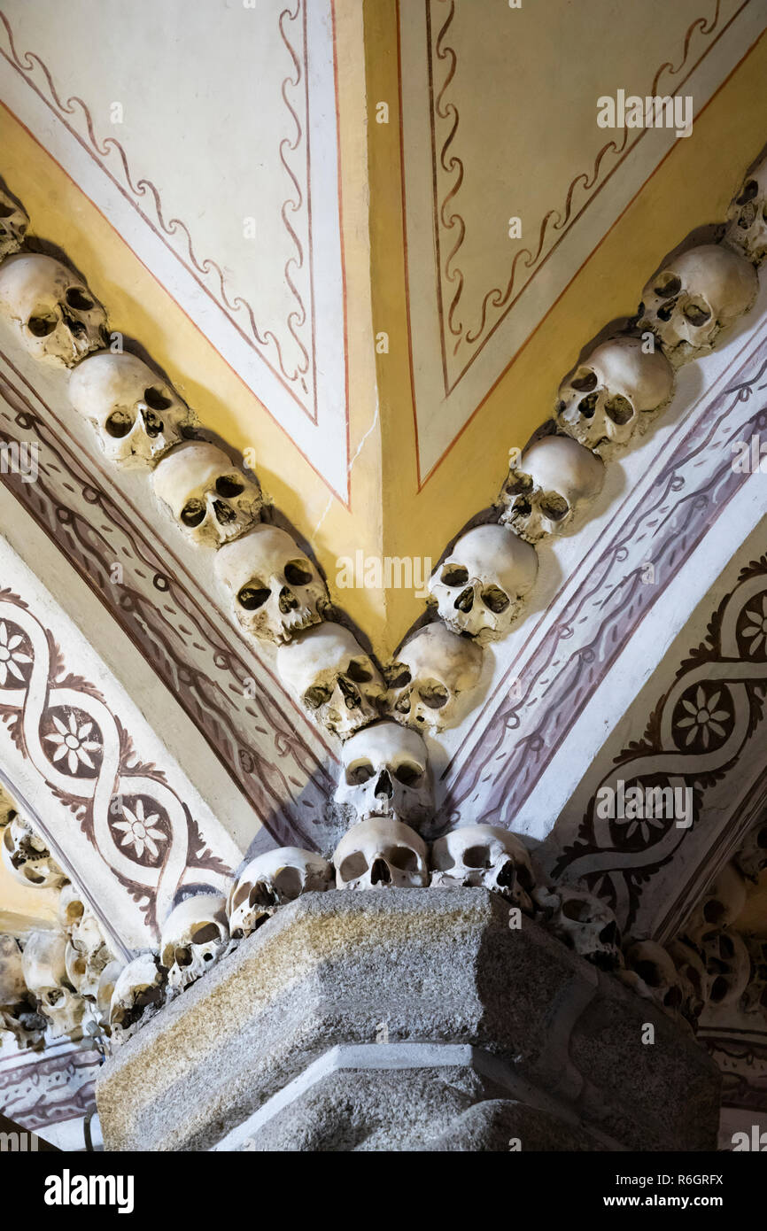 Skulls and bones of former monks decorating the walls inside the Capela dos Ossos bone chapel, Evora, Alentejo, Portugal, Europe Stock Photo