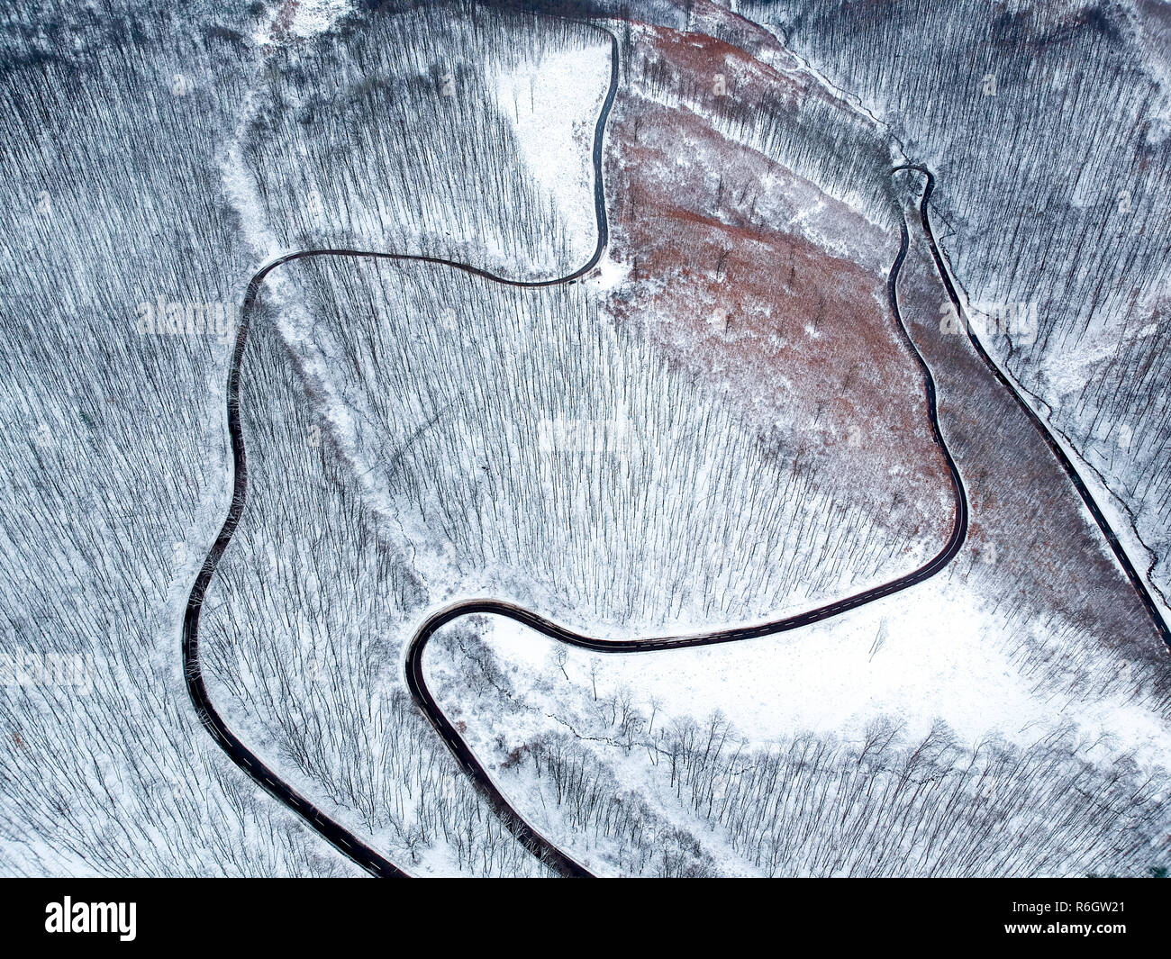 Aerial view of winding road in winter Stock Photo - Alamy