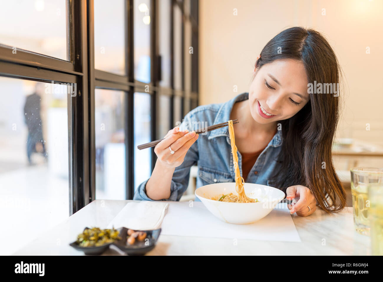 Woman enjoy noodles in chinese restaurant Stock Photo Alamy